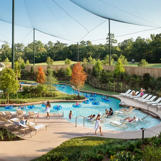Families floating in the Forest Oasis lazy river at The Woodlands Resort